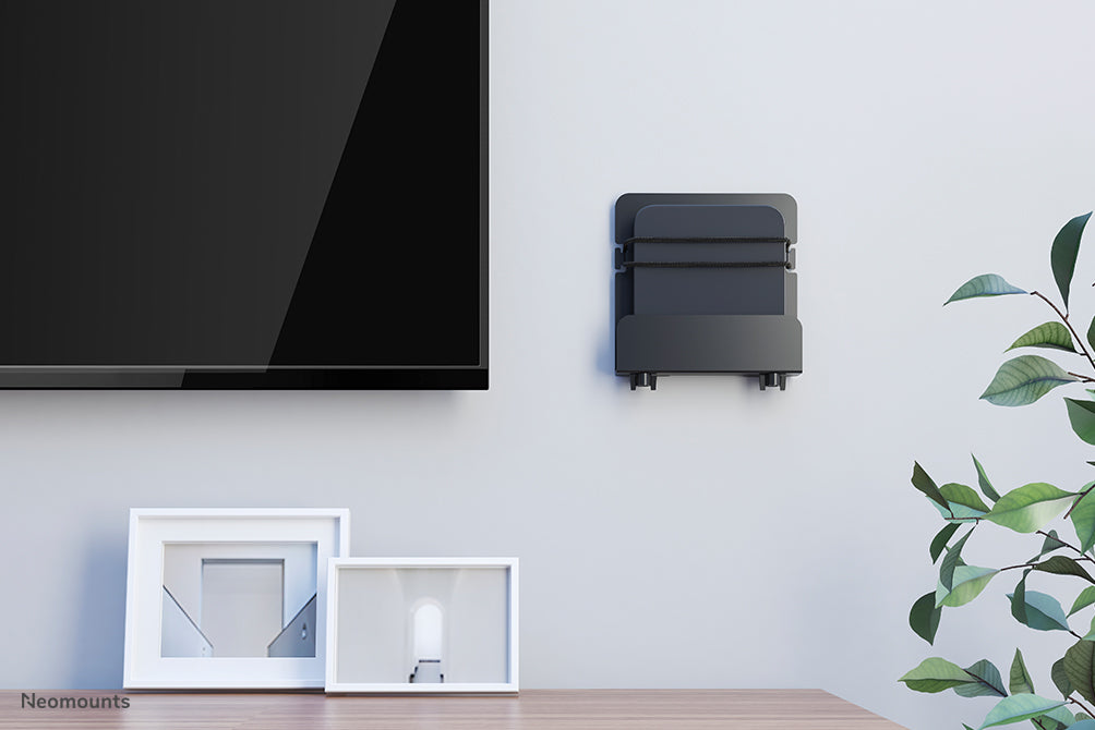 Neomounts AWL-450BL is een universele, in diepte verstelbare (4,7-7,6 cm) mediaspeler houder - Zwart